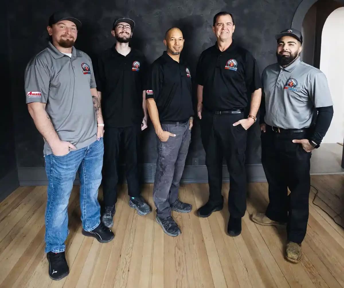 The Wasatch Peaks Heating & Air Conditioning team in West Jordan, Utah β five uniformed HVAC technicians